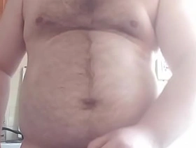 The gay man put his massive balls on the table and started masturbating his cock!