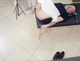 Doctor who performs a prostate exam ends up sticking a strap-on in the patient's ass.